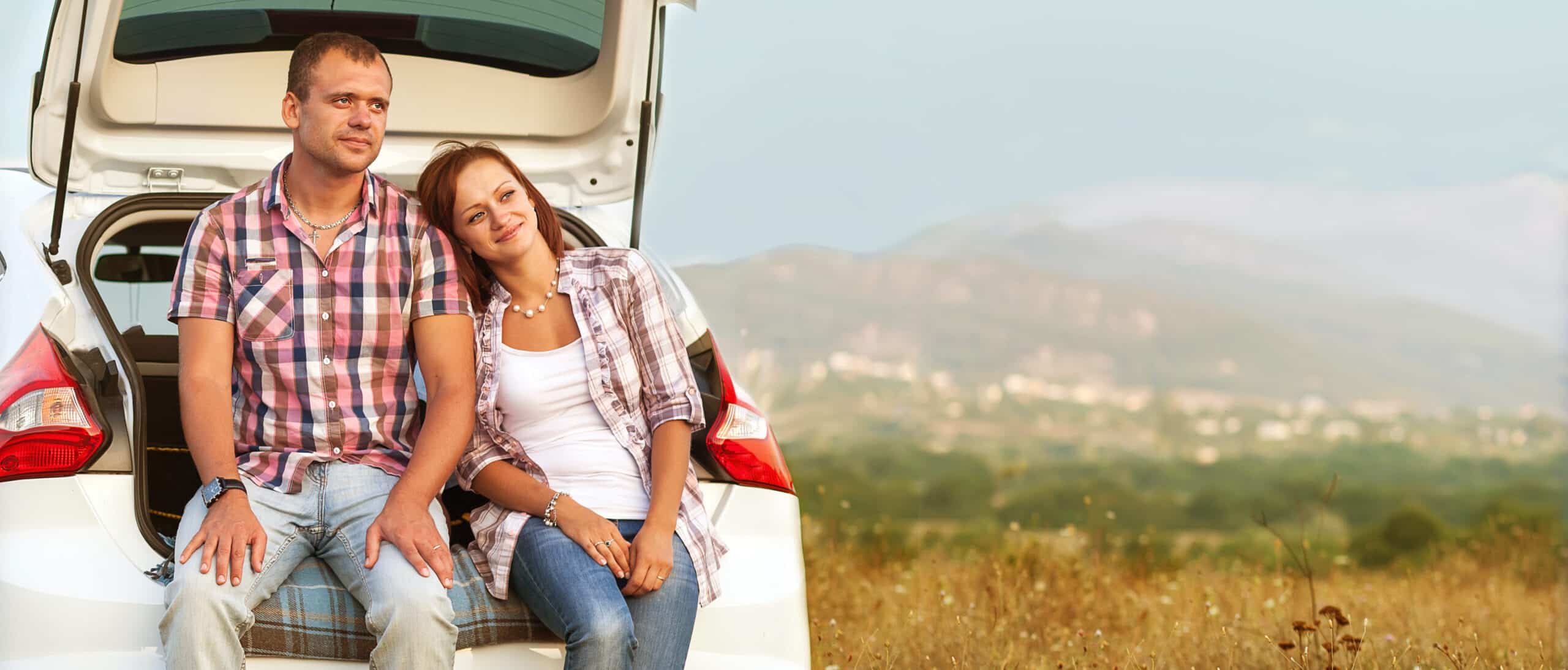 family in the mountains by car